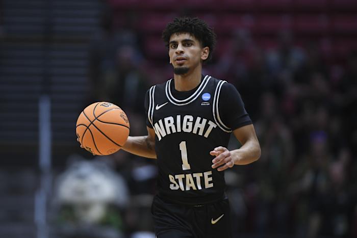 Wright State Raiders guard Trey Calvin (1) dribbles the basketball against the Arizona Wildcats during the first half during the first round of the 2022 NCAA Tournament at Viejas Arena.